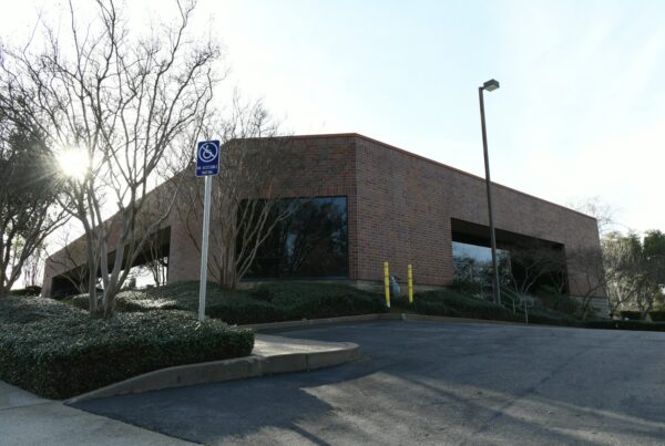 Brick low-rise office building on a sunny day, typical owner-occupied commercial real estate in Kansas City