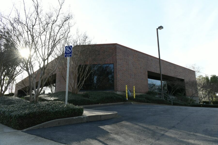 Brick low-rise office building on a sunny day, typical owner-occupied commercial real estate in Kansas City